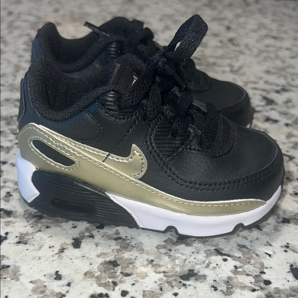 Kids Black and Gold NIKE Sneakers